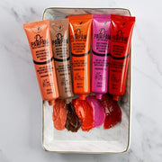 The Dr PAWPAW balm range with colour swatches, showing Rich Mocha alongside the other shades