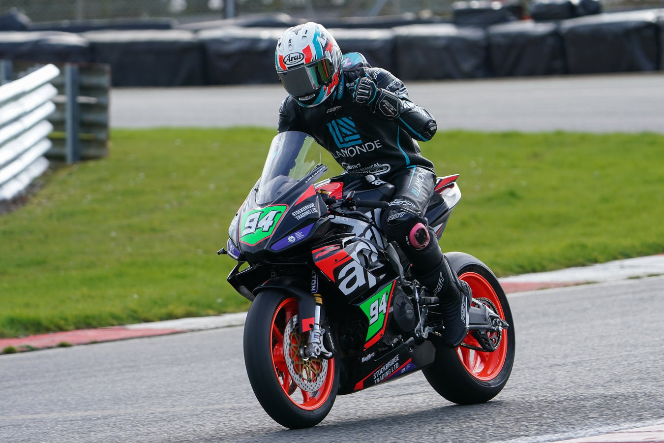 Tom Vaughan gives a thumbs up on the number 94 Aprilia RS660 with Stockbridge Trading branding. Photo: Bourne Photographic